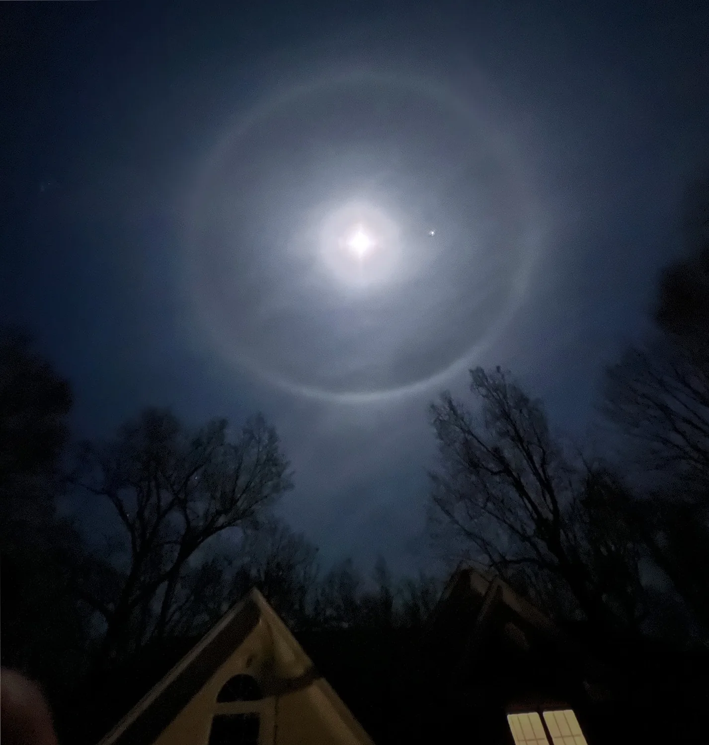 Moon in the night sky with 22degree halo.