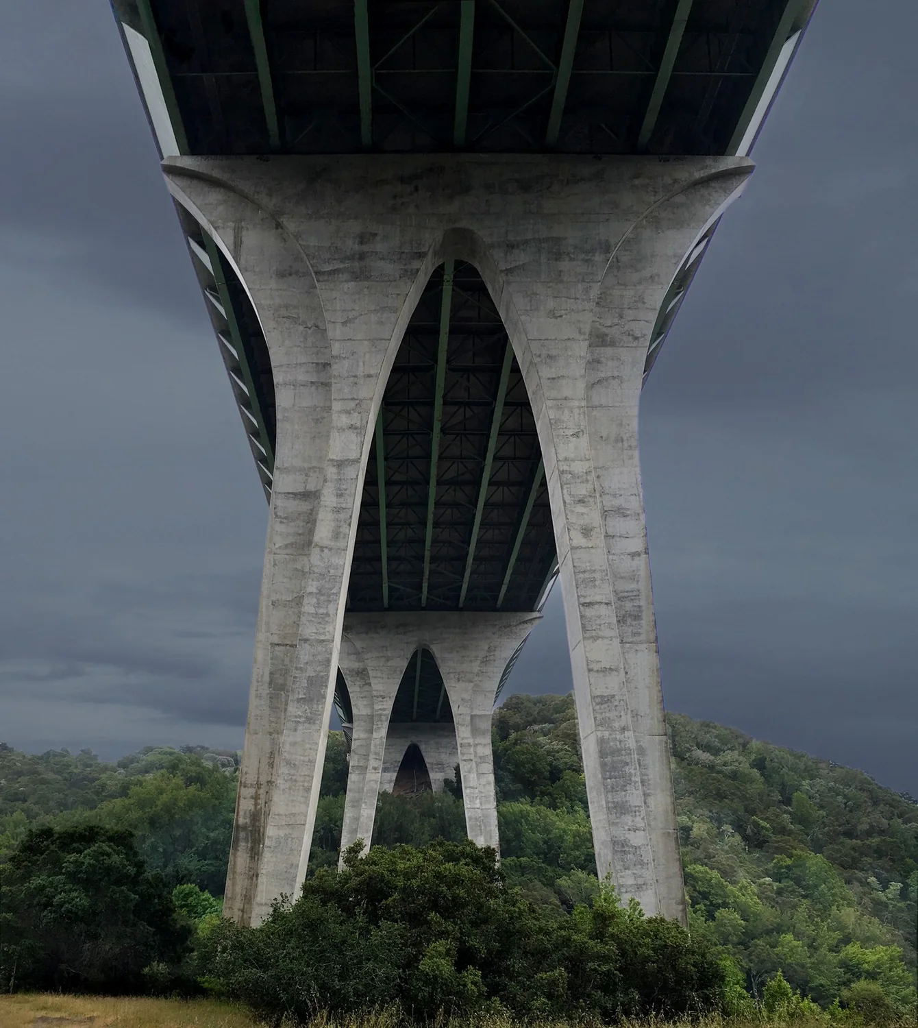 A picture of a highway overpass with tall concrete towers.