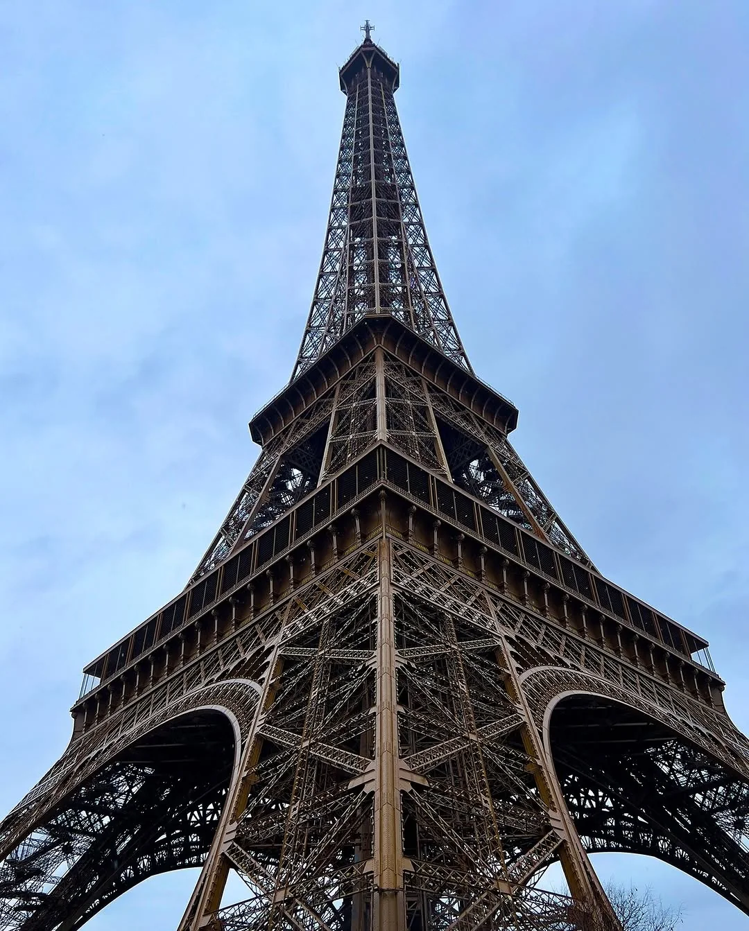 The Eiffel Tower, looking up from the base. It's an impressive structure, particularly considering when it was built.